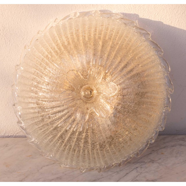 Gorgeous transparent/gold Murano ceiling light. The ceiling light consists of 3 glass elements, the central plate and a...