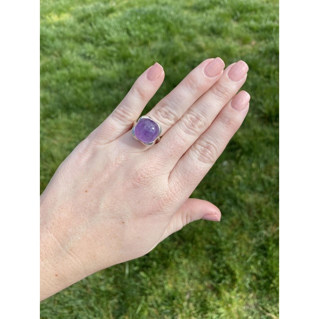 Stones: - amethyst, 1 stone - round cabochon - 14 mm - approximately 9.50 carat Ring Size 5.5 Rise Off Of Finger: 9.3 mm...