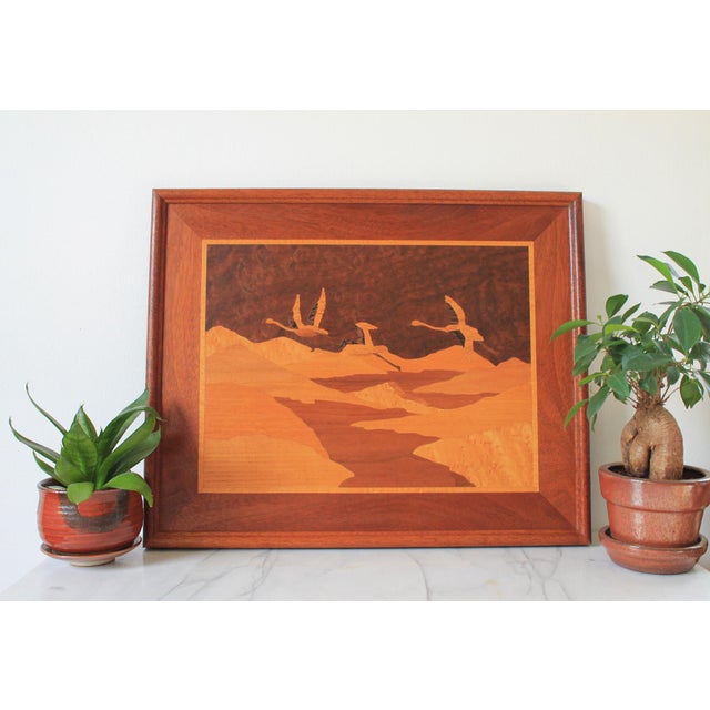 Vintage framed handmade marquetry picture features wood inlay artwork of birds soaring over a landscape. No makers mark....