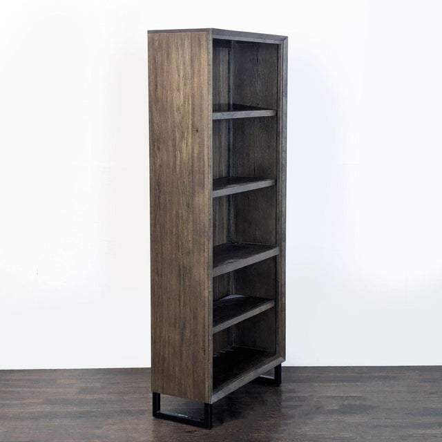 This bookshelf features a sleek, tall design with five spacious shelves, perfect for organizing books, decor, or storage...