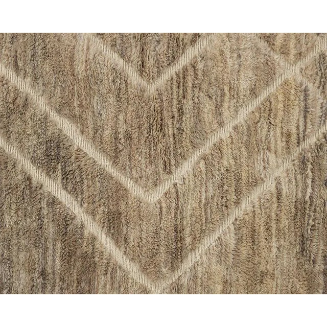 Sophisticated hand-knotted wool rug, blending Light Taupe, Fawn, Velvet Fawn, and Warm Taupe tones with dynamic handwoven...