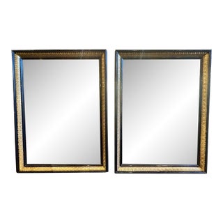 Pair of Continental Ebonized and Giltwood Mirrors For Sale
