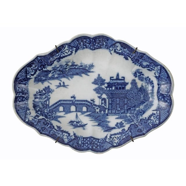 Indulge in the elegance of the 18th Century with this rare pair of English pearlware lozenge-shaped dessert dishes with...