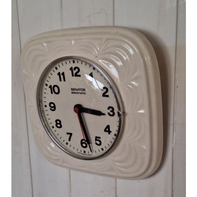 Vintage German Senator Wall Clock with White Ceramic Case by Junghans, 1970s, in Very Good conditions. Designed 1970 to...