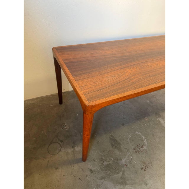 This beautiful large vintage Danish rosewood coffee table is a striking example of Mid Century Modern Scandinavian design,...