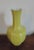 Large Chinese monochrome yellow porcelain bottle shaped vase. The foot and upper rims are octagons and the urn has eight...