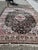 An elegant handmade vintage Chinese silk rug from the 1970s, distinguished by its refined floral composition and luxurious...