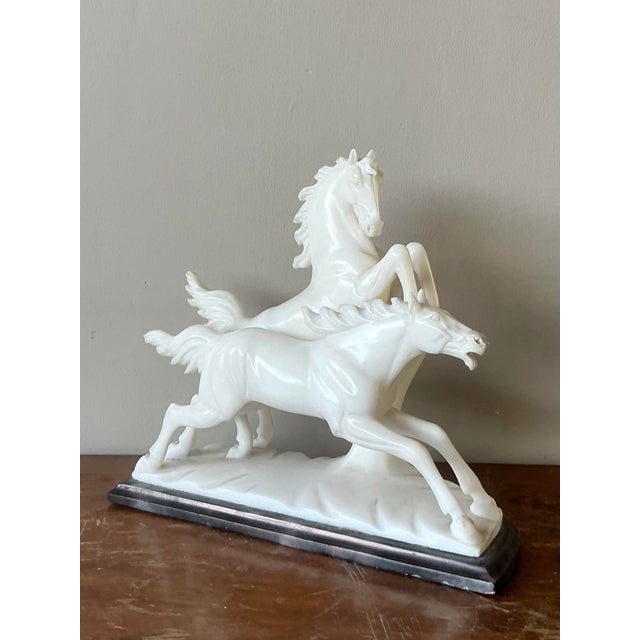 Infuse your decor with the dramatic energy of this exquisite vintage Italian horse sculpture. A stunning example of...