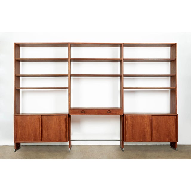 This impressive vintage Danish mid-century modern Model RY100 three-bay wall unit or bookcase was designed by Hans J....