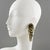 These stunning dangling glass clip-on earrings, shaped like a lionfish, feature an oversized shoulder-duster design and a...