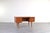 A Danish desk from the 1960s, crafted in teak wood and representing the classic mid-century modern style. While its form...