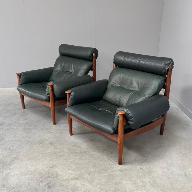 Remarks: Set mid century lounge chairs by Eric Merthen for Ire Möbel AB, Sweden 1960s. Oak frames with green leather...