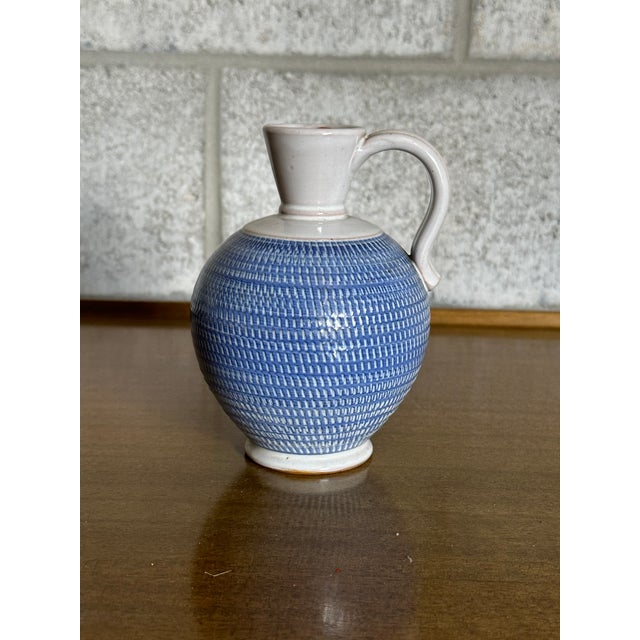 Very nice small pitcher vase produced by Töreboda in Sweden circa 1960s. Features a nice form and classic colors that...