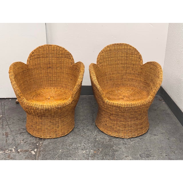 Design Plus Gallery presents a pair of Vintage Floral Boho Style Wicker Lounge Chairs. Each chair is woven in natural...