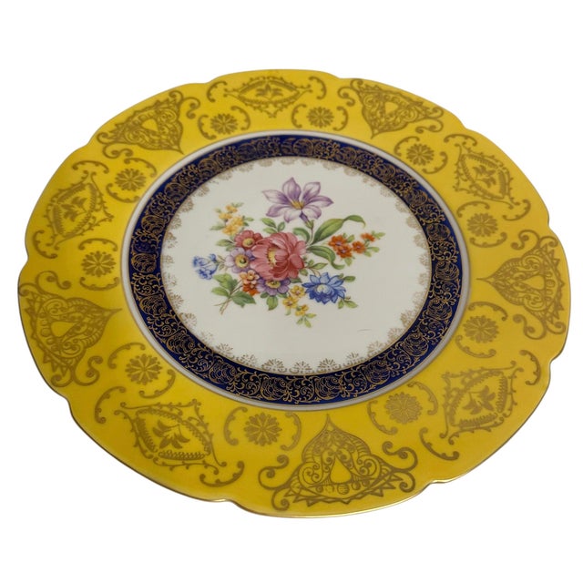 Hand painted, circa 1920s Porcelain, gold. Fine China plate with floral design and gold edging.