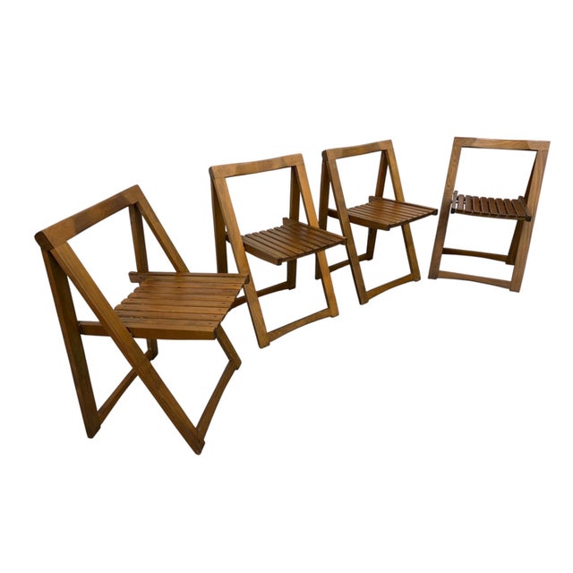 Add timeless European charm to your home with this exceptional set of four Mid-Century Modern Walnut Slatted Dining...