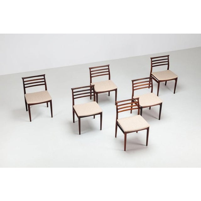 A distinctive set of six dining chairs by Erling Torvits, produced by Sørø Stolefabrik in Denmark during the 1960s....