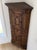 This is an early nineteenth century antique pine corner cabinet, circa 1800. It has two paneled cabinet doors and a middle...