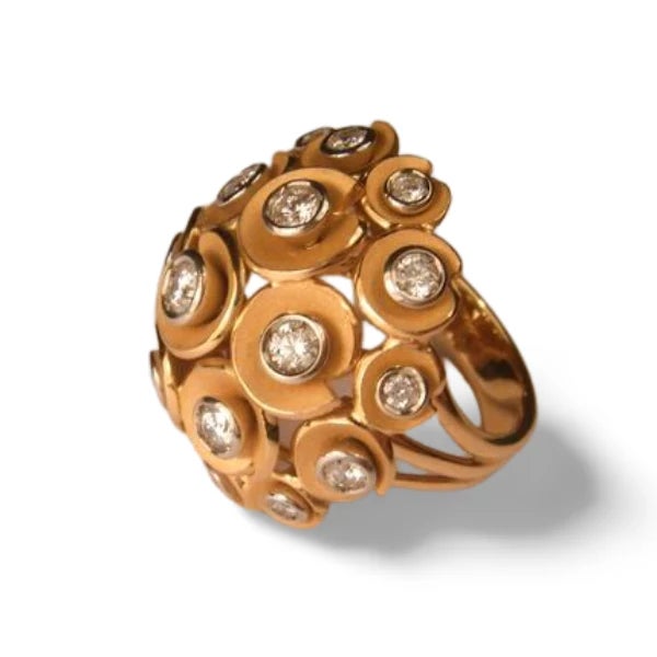 18K Pink Rose Gold Diamond Dome Cocktail Ring. This designer cocktail ring features 19 brilliant round diamonds totaling...