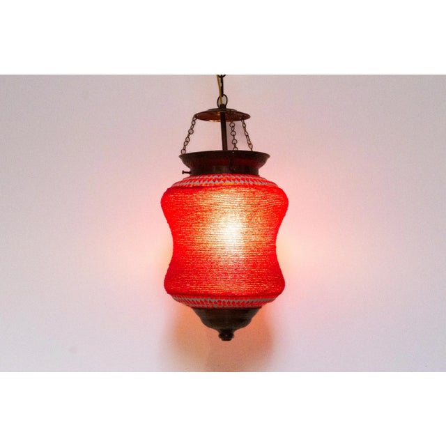 Lively and colorful, these hand-crafted beaded and mosaic lanterns are made hand-cut pieces of hued glass in a geometric...