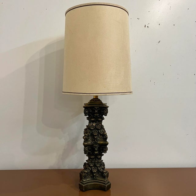 Ornate table lamp with bronze and gold detailing. Height of lamp with shade is 40.75”H Lamp shade dimensions 16.5”w x...