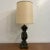 Ornate table lamp with bronze and gold detailing. Height of lamp with shade is 40.75”H Lamp shade dimensions 16.5”w x...