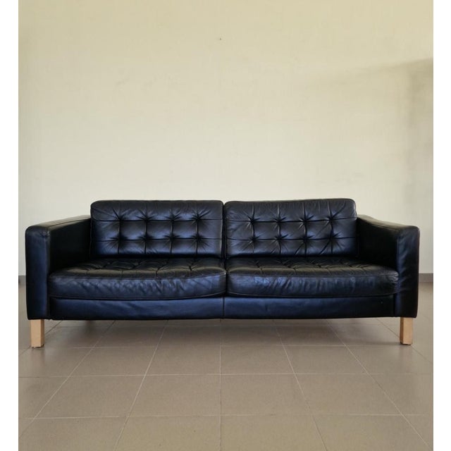 Large black Art Deco sofa, made with a solid construction for maximum strength and durability. It is upholstered with...
