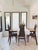 A sculptural set of four Danish Modern dining chairs crafted in solid teak, circa 1960s. These chairs feature elegantly...