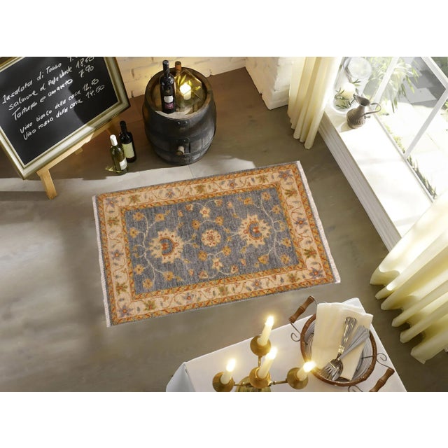 "Enhance the ambiance of your home with this magnificent Persian-influenced Turkish hand-knotted rug made by skilled...