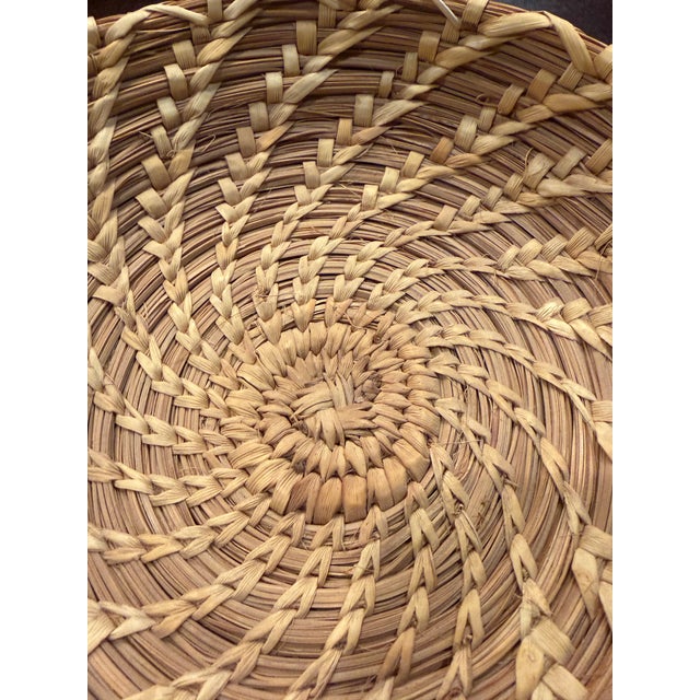 Add an organic, textural element to your home with this beautiful vintage Southwestern hand-woven basketry bowl. Crafted...