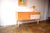 This simple sideboard is an original piece from the 1960s. The cabinet features genuine birch veneer. The light accents...