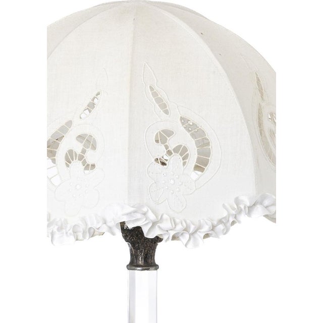 «Portuguese lamp; 20th century; with white metal base and crown and glass stem; electrified with embroidered linen...