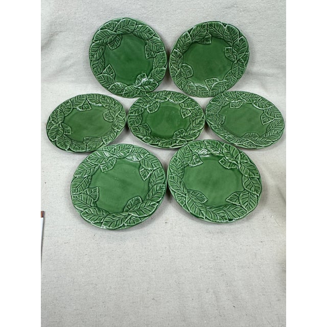 Seven vintage Bordallo Pinheiro Ivy Leaf plates. This is a pre-owned item so please see all pictures and ask any questions.