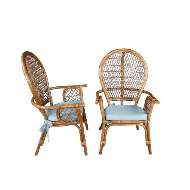 Pair of Mid Century Coastal Bohemian Armchairs. Features a bamboo frame with interlaced rattan balloon back and removable...