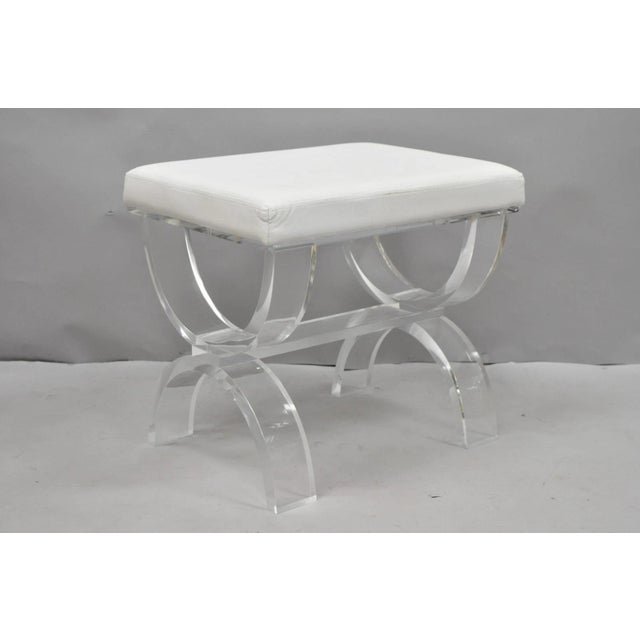 Contemporary Modern Thick Lucite Acrylic X-Form Vanity Bench Stool with White Vinyl Seat. Circa 21st Century, Pre-owned....