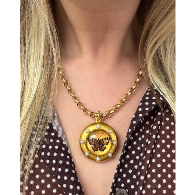 This rare antique locket boasts an intricate Essex Crystal depicting a butterfly surrounded by possibly natural pearl...