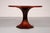 A remarkably rare round extending dining table designed in the 1960s by the celebrated Italian architect and furniture...
