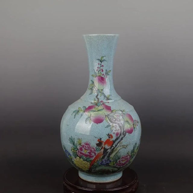 H-44cm,W-25cm This Chinese vintage porcelain vase from the Qing Dynasty, marked with the Qianlong seal, features a...