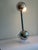 70s barbell task light in the manner of John Mascheroni embodies the retro elegance design of the 70s. Polished chrome...