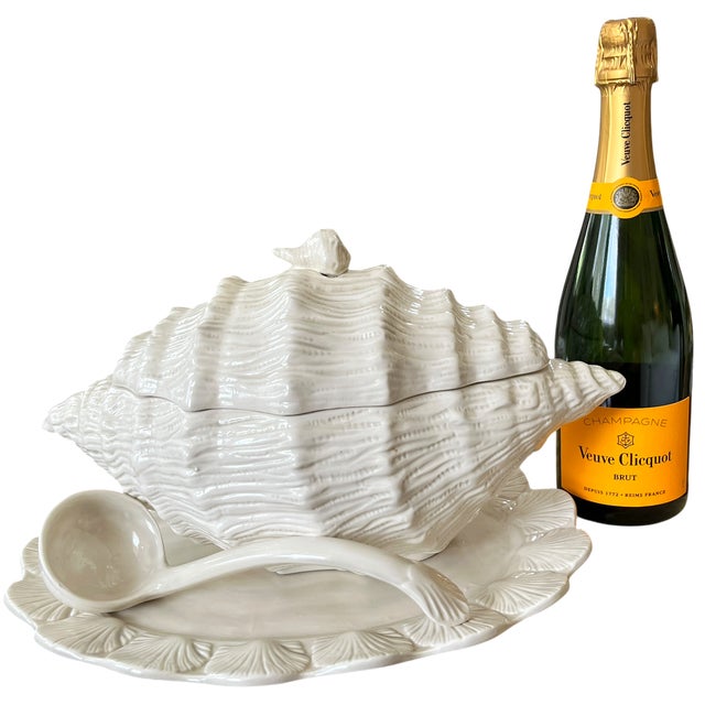 Wonderfully sculptural shell-form tureen in glossy white ceramic, complete with its coordinating underplate and ladle....