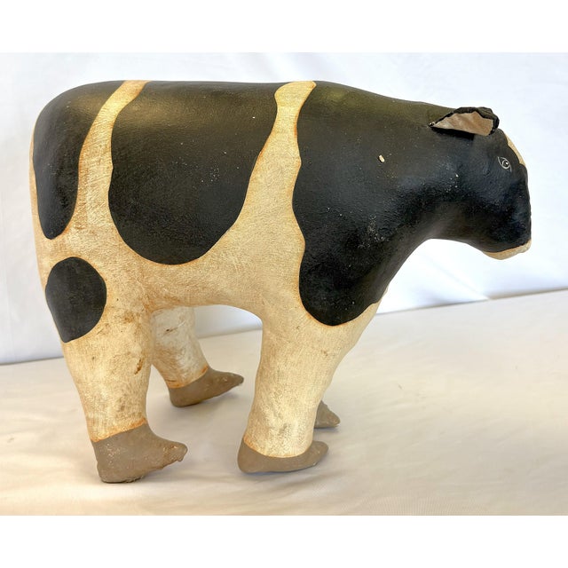 Sweet artisan crafted folk art style cow soft sculpture. She is made of canvas stuffed and sewn like a pillow, and painted...