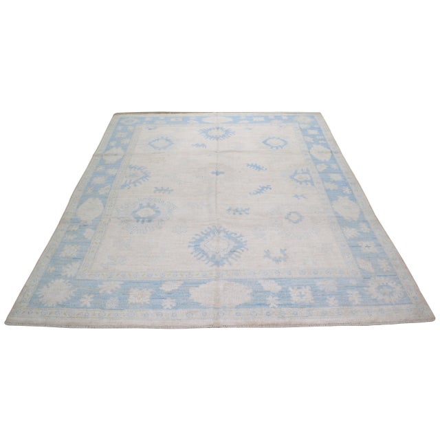 Turkish Oushak hand knotted rug with natural colors, contemporary style and soft texture.