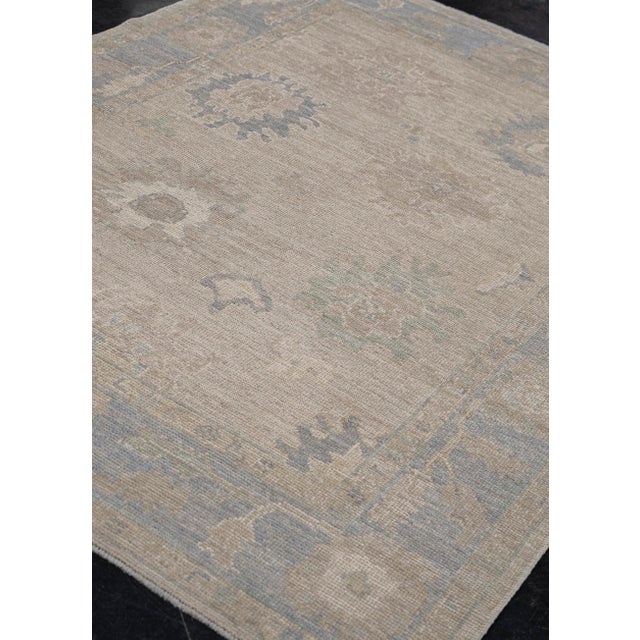 Turkish Oushak Rug Taupe, Beige & Blue Handwoven Wool Rug 5'2" X 7' This handwoven Turkish Oushak rug is a timeless piece...