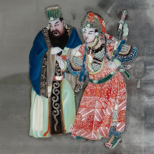 Antique Chinese reverse painted mirror on a larger-than-average scale, with three figures painted in the central section...