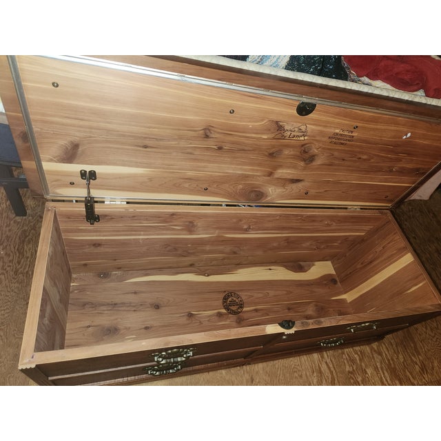 Cedar Lane hope chest, upholstery could use some cleaning and shows a little wear on front corner, but is intact, wood in...