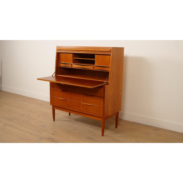 This stunning vintage writing desk by Erling Torvits is a fine example of mid-century Danish design. Crafted from warm...
