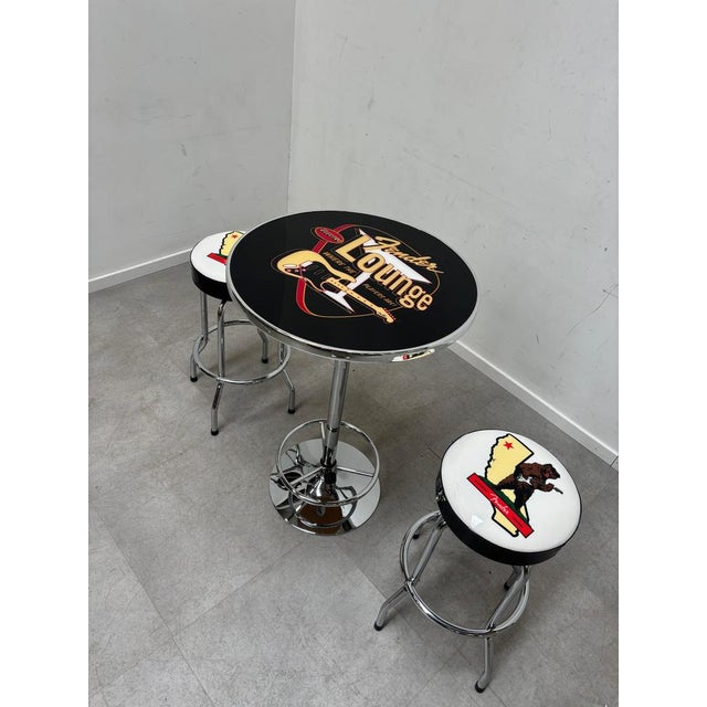 “Fender” Bar Set - Table + Barstools (2) In excellent condition. Ideal for mancave! table 70 cm ø , 104 H. barstools 35 ø...