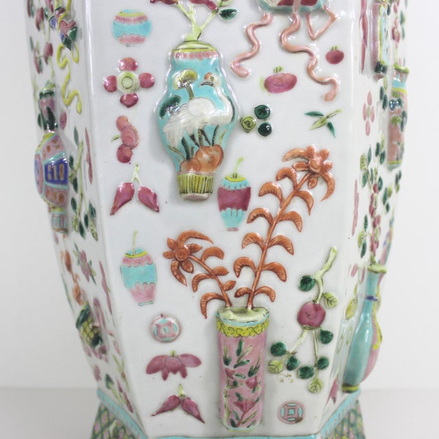 This is a stunning vintage ceramic Chinese floor vase with raised precious objects. There is so much detail on this vase....