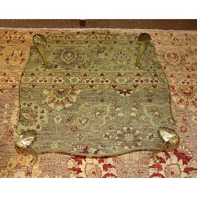 ​P.E Guerin Attributed Hollywood Regency Glass And Bronze Feet Coffee Table Dimensions : 38" Wide X 38" Deep X 15.5" Tall...