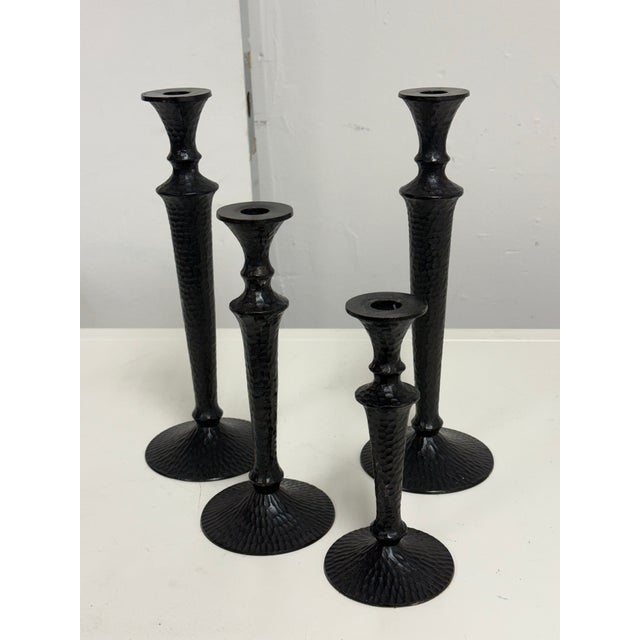 Design Plus Gallery presents a Set of Four Seville Hammered Metal Candle Holders from Pottery Barn. This coordinated set...